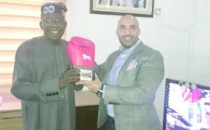 tinubu - autographed gloves - sunnews.jpg tinubu - autographed gloves - sunnews.jpg