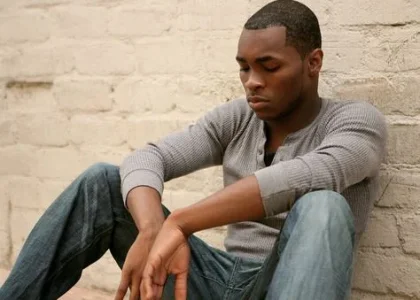 depressed black man.JPG depressed black man.JPG