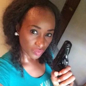 Nkemike holding a gun.jpg Nkemike holding a gun.jpg