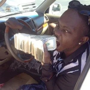 Waconzy with $100,000 cash (1).jpg Waconzy with $100,000 cash (1).jpg