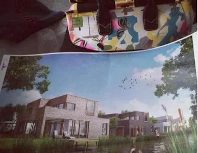 Maheeda and image of what the house will look like.jpg Maheeda and image of what the house will look like.jpg