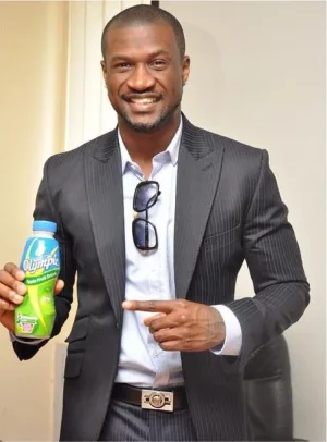 Peter Okoye holding a bottle of Olympic Milk.jpg Peter Okoye holding a bottle of Olympic Milk.jpg