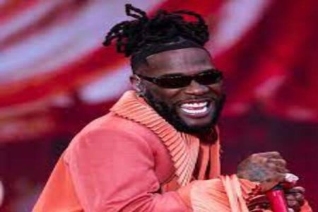Burna Boy's Laugh Emoji Sparks Heated Exchange with Davido Fan Post-AFCON Loss