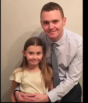 chloe with her dad.PNG